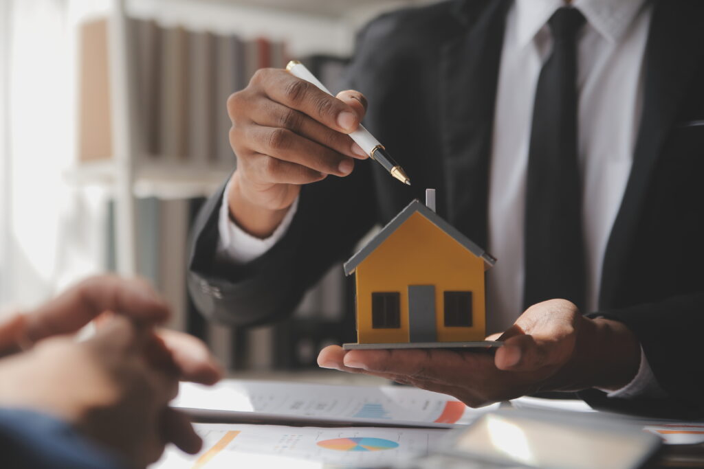 Real estate agent and customer signing contract to buy house, insurance or loan real estate.rent a house,get insurance or loan real estate or property.